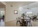 Cozy living area with dining table, ceiling fan, and a view to the outdoor balcony at 205 N 74Th St # 261, Mesa, AZ 85207
