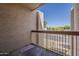Patio features stucco walls and metal railing overlooking street and community at 205 N 74Th St # 261, Mesa, AZ 85207