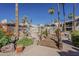 Inviting community pool area featuring a decorative bridge, lush landscaping, and a relaxing atmosphere at 205 N 74Th St # 261, Mesa, AZ 85207