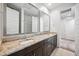 This bathroom features double sinks, spacious granite countertops, and ample storage space at 21075 E Estrella Rd, Queen Creek, AZ 85142
