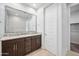 Well lit bathroom with double sink vanity and large mirror at 21075 E Estrella Rd, Queen Creek, AZ 85142