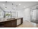 Open-concept kitchen with granite counters, a stainless steel dishwasher, and plenty of natural light at 21075 E Estrella Rd, Queen Creek, AZ 85142