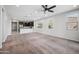 Bright living room with carpet and open to the modern kitchen at 21075 E Estrella Rd, Queen Creek, AZ 85142
