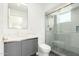 Modern bathroom with gray vanity, glass shower, and sleek fixtures at 2130 E Turney Ave # 4, Phoenix, AZ 85016