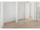Bright bedroom featuring hardwood floors, a closet, and white walls and trim at 2130 E Turney Ave # 4, Phoenix, AZ 85016