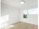 Bright bedroom features hardwood floors and a large window for ample natural light at 2130 E Turney Ave # 4, Phoenix, AZ 85016