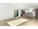 Bright, open-concept living space with hardwood floors seamlessly flows into a modern kitchen at 2130 E Turney Ave # 4, Phoenix, AZ 85016