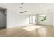 Sunlit living room features hardwood floors, white walls, recessed lighting, and modern pendant fixtures at 2130 E Turney Ave # 4, Phoenix, AZ 85016