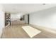 Open living space with modern kitchen featuring a large island, sleek cabinetry, and stainless steel appliances at 2130 E Turney Ave # 4, Phoenix, AZ 85016