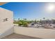Enjoy neighborhood views from this rooftop deck with modern railing and sleek white exterior at 2130 E Turney Ave # 4, Phoenix, AZ 85016