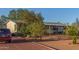 Charming single story home with desert landscaping and a gravel driveway at 22216 W Bajada Dr, Wittmann, AZ 85361