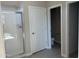Bathroom featuring a tiled shower and a view into a separate toilet area at 23214 W Miami St, Buckeye, AZ 85326