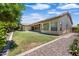 Expansive backyard with lush green lawn and covered patio, perfect for entertaining at 2370 W Maplewood St, Chandler, AZ 85286