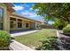 Spacious backyard featuring a well-maintained lawn, covered patio, and beautiful landscaping at 2370 W Maplewood St, Chandler, AZ 85286