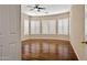 Large bedroom with wood flooring, neutral colored walls, and white shutters at 2370 W Maplewood St, Chandler, AZ 85286