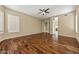 Spacious bedroom featuring hardwood floors, neutral paint, and a ceiling fan at 2370 W Maplewood St, Chandler, AZ 85286
