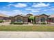Charming single-story home featuring stone accents, a tile roof, and manicured landscaping at 2370 W Maplewood St, Chandler, AZ 85286
