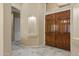 Elegant foyer features tile flooring, a niche, and a wooden double-door entrance at 2370 W Maplewood St, Chandler, AZ 85286