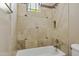 Tiled shower with built in niche and decor accents at 2370 W Maplewood St, Chandler, AZ 85286