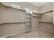 Spacious walk-in closet with custom shelving for optimal organization at 2370 W Maplewood St, Chandler, AZ 85286