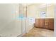 Bathroom featuring a shower, tub, wooden cabinets, and tile flooring at 23853 W Hammond Ln, Buckeye, AZ 85326