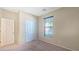 Cozy bedroom featuring a window with blinds, carpeted floors, and a closet for ample storage at 23853 W Hammond Ln, Buckeye, AZ 85326