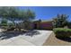 Attractive one-story home featuring well-maintained landscaping, a two-car garage, and desert landscaping at 23853 W Hammond Ln, Buckeye, AZ 85326