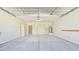 Spacious two-car garage with overhead door and ample storage cabinets at 23853 W Hammond Ln, Buckeye, AZ 85326