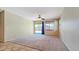 A spacious living room with natural light and a sliding glass door at 23853 W Hammond Ln, Buckeye, AZ 85326