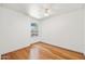 Bright bedroom with hardwood floors, ceiling fan, and large window at 255 S Kyrene Rd # 139, Chandler, AZ 85226