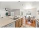 Open kitchen layout with stainless steel appliances and a view to the dining area at 255 S Kyrene Rd # 139, Chandler, AZ 85226