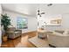 Bright living room with hardwood floors, cozy seating, and natural light, with open kitchen at 255 S Kyrene Rd # 139, Chandler, AZ 85226
