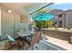 Relaxing patio area featuring outdoor furniture, sun protection, and pretty decor at 255 S Kyrene Rd # 139, Chandler, AZ 85226