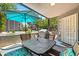Well-kept patio with outdoor seating, umbrella for shade, and lush greenery views at 255 S Kyrene Rd # 139, Chandler, AZ 85226
