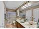 Bathroom with double vanity, tiled floor, and shower-tub combo at 31133 N 132Nd Ln, Peoria, AZ 85383