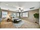 Spacious bedroom with ceiling fan, plantation shutters and neutral decor at 31133 N 132Nd Ln, Peoria, AZ 85383