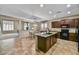 Open kitchen with granite countertops, stainless steel appliances, and ample cabinet space at 31133 N 132Nd Ln, Peoria, AZ 85383