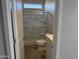 Clean bathroom with a glass-enclosed shower, modern fixtures, and light-colored flooring at 3125 S 232Nd Ave, Buckeye, AZ 85326