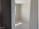Bright bedroom featuring neutral carpet and a large window for natural light at 3125 S 232Nd Ave, Buckeye, AZ 85326