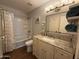 Bathroom with granite vanity, modern lighting, and bath tub at 3145 W Acoma Dr, Phoenix, AZ 85053