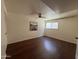 Bedroom with wood-look floors, and ceiling fan at 3145 W Acoma Dr, Phoenix, AZ 85053
