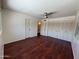 Bedroom featuring wood-look floors, and closet space at 3145 W Acoma Dr, Phoenix, AZ 85053