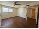Bedroom featuring wood-look floors and closet space at 3145 W Acoma Dr, Phoenix, AZ 85053