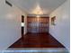 Traditional dining room featuring dark wood floors and matching built-in wood cabinets at 3145 W Acoma Dr, Phoenix, AZ 85053