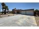 Charming single-Gathering home with a spacious driveway, mature palm trees, and a two-car garage at 3145 W Acoma Dr, Phoenix, AZ 85053