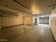 Spacious garage with painted floor and walls, offering potential for customization and storage solutions at 3145 W Acoma Dr, Phoenix, AZ 85053