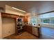Updated kitchen featuring stainless steel appliances, granite countertops, and abundant natural light at 3145 W Acoma Dr, Phoenix, AZ 85053