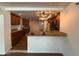 Open kitchen showcasing granite countertops, a breakfast bar, and seamless connectivity to dining at 3145 W Acoma Dr, Phoenix, AZ 85053