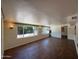 Spacious living room with wood-look floors and ample natural light at 3145 W Acoma Dr, Phoenix, AZ 85053