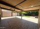 Covered patio featuring tile floors, a ceiling fan, and a view of the backyard at 3145 W Acoma Dr, Phoenix, AZ 85053